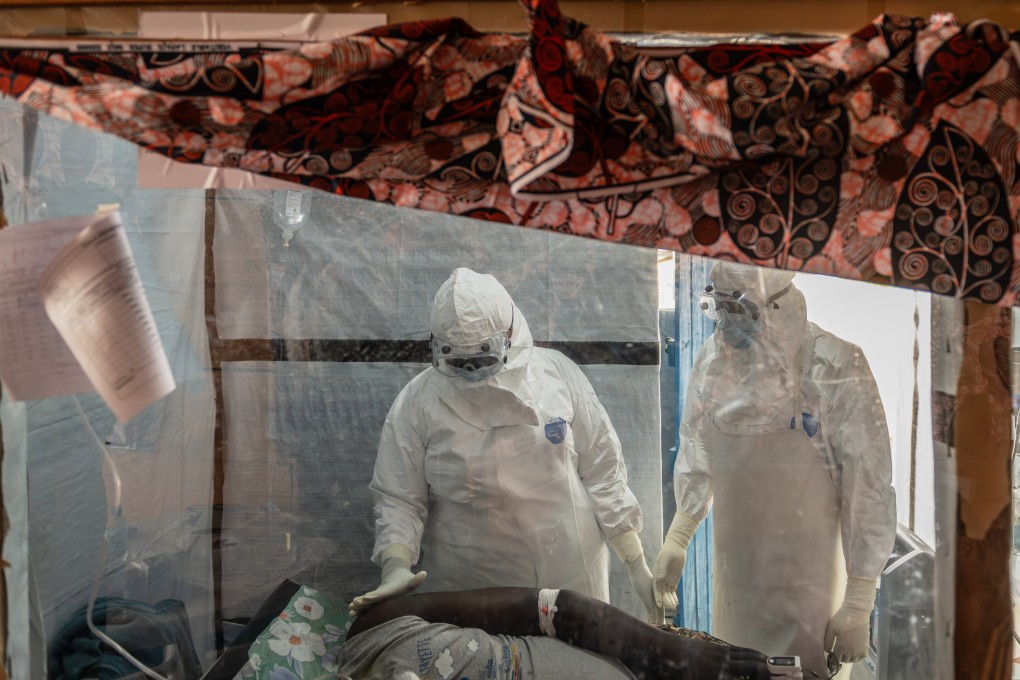Health workers tend to an Ebola patient in Ituri in the Democratic Republic of Congo (DRC) on June 18. Photo: AP