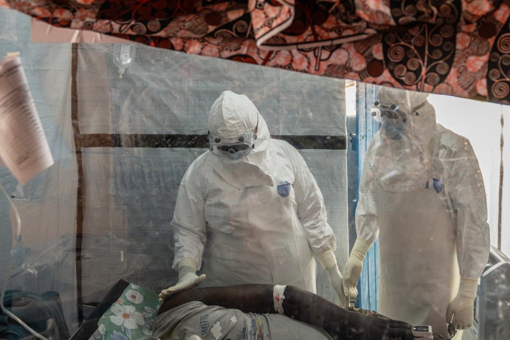 Health workers tend to an Ebola patient in Ituri in the Democratic Republic of Congo (DRC) on June 18. Photo: AP