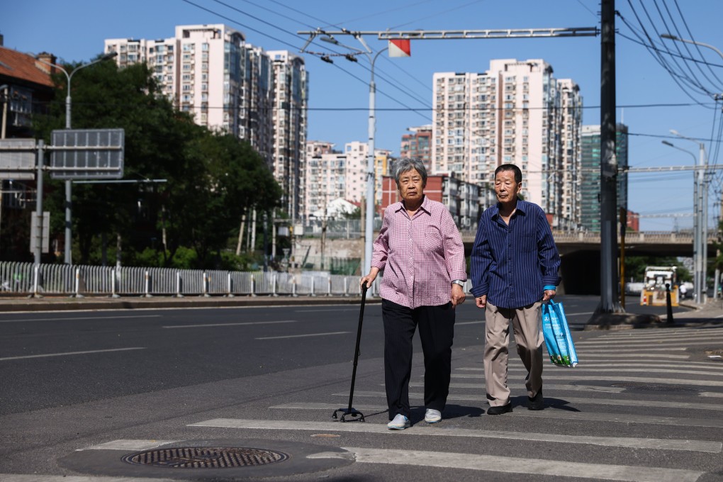 Two elderly people in Beijing on June 1. Photo: EPA