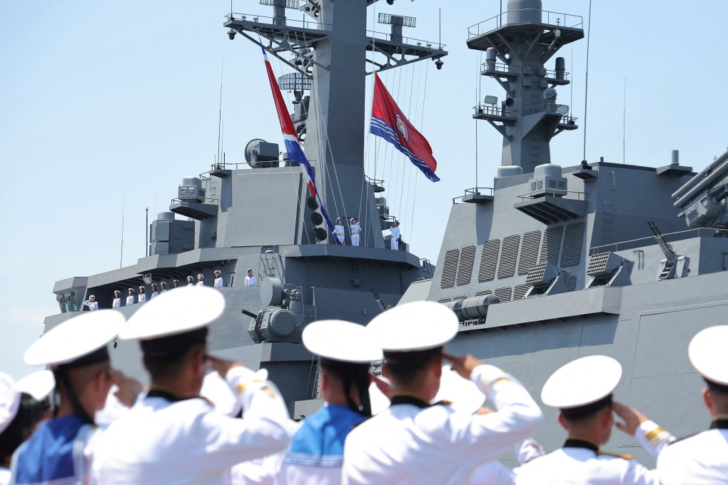Sailors salute during the commissioning ceremony of the Choe Hyon warship at the porty city of Nampo in North Korea on Wednesday. Photo: KCNA via Reuters