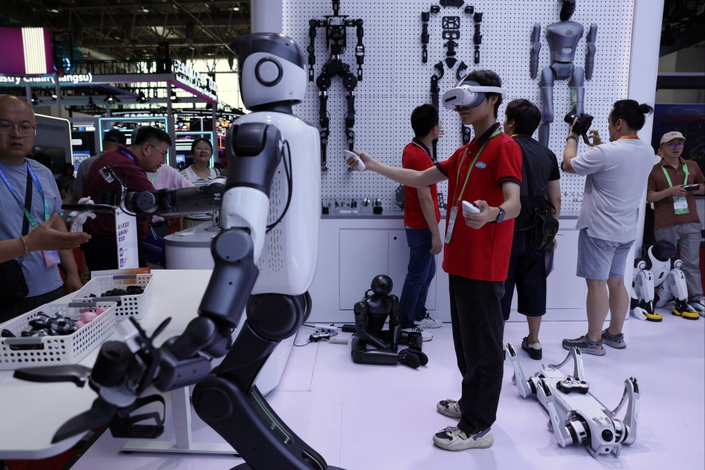 A staff member demonstrates a humanoid robot at the Lens Technology booth during the China International Supply Chain Expo in Beijing on June 22, 2026. Photo: Reuters