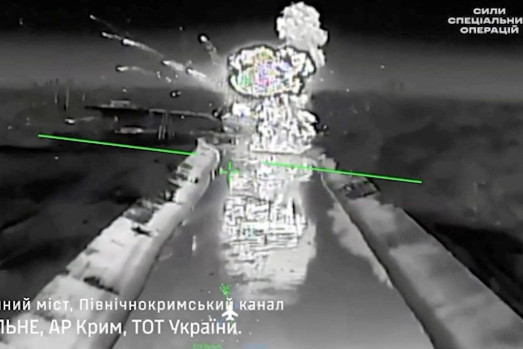 Drone footage shows fire and smoke rising from a bridge, which Ukraine's military says was destroyed by them, near Rozdolne, Crimea, in this screengrab from a handout video released on Tuesday. Photo: Reuters