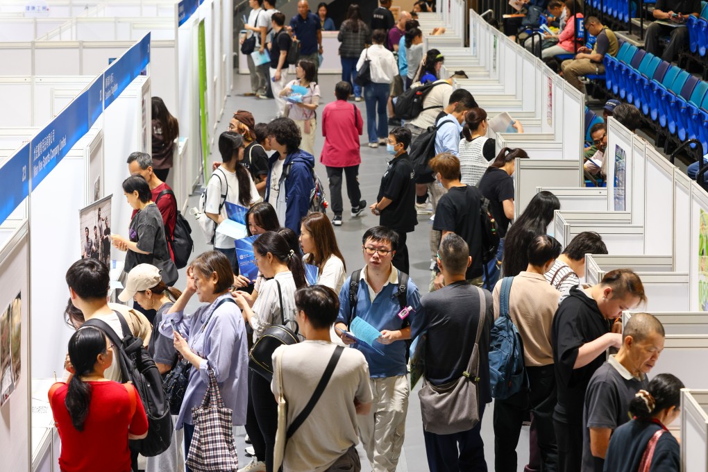 People visit booths at a job fair at MacPherson Stadium in Mong Kok on May 12. Photo: Dickson Lee