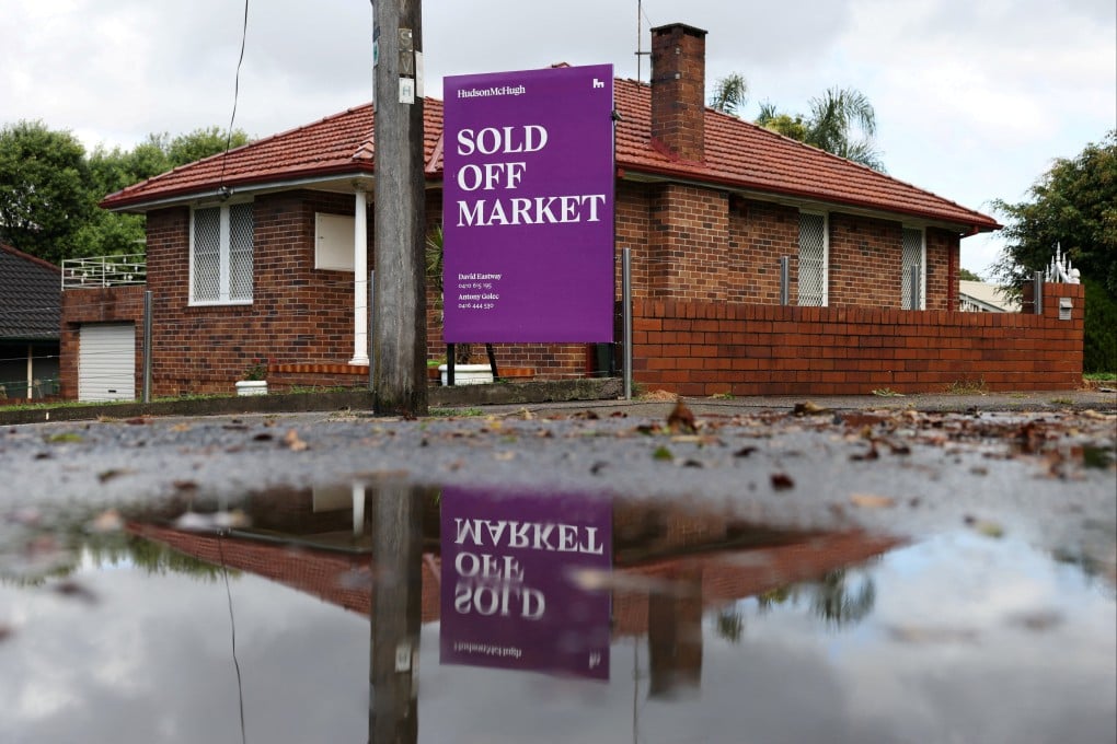A “Sold Off Market” sign is displayed outside a property in Sydney, Australia. Photo: Reuters