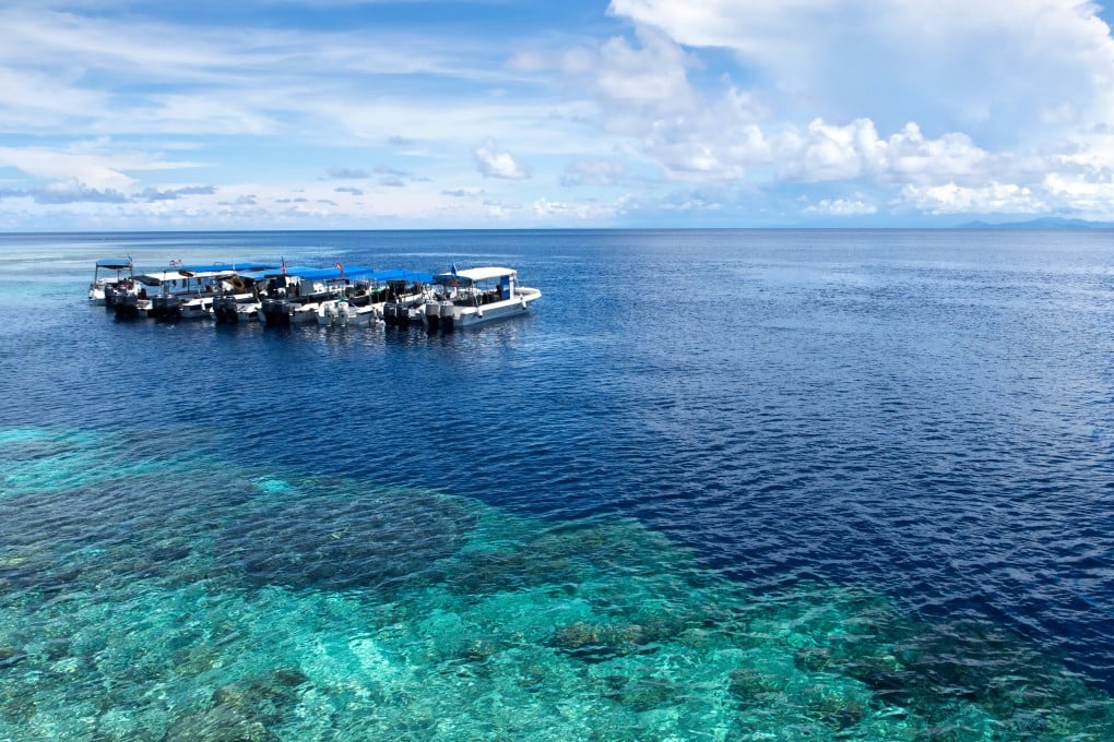 Boats anchor at a dive site off Sipadan Island in Sabah, Malaysia. Photo: Shutterstock