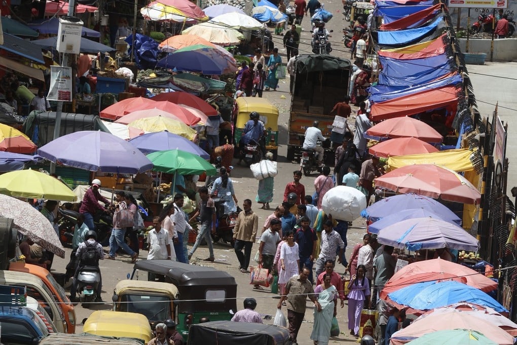 People shop at a city market in Bangalore on June 23. India’s equity market is no longer in the world’s top five by market capitalisation, having fallen behind Hong Kong, Taiwan and South Korea in recent years. Photo: EPA
