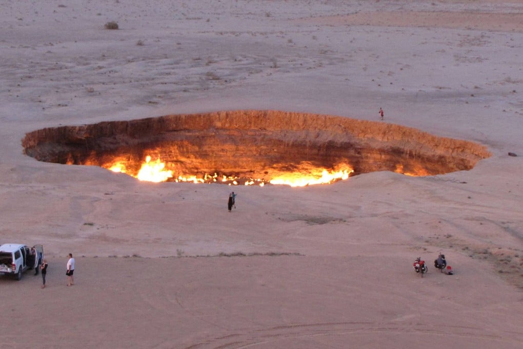People visiting the “Gateway to Hell”, a crater of burning gas in the heart of Turkmenistan’s Karakum Desert. Photo: AFP