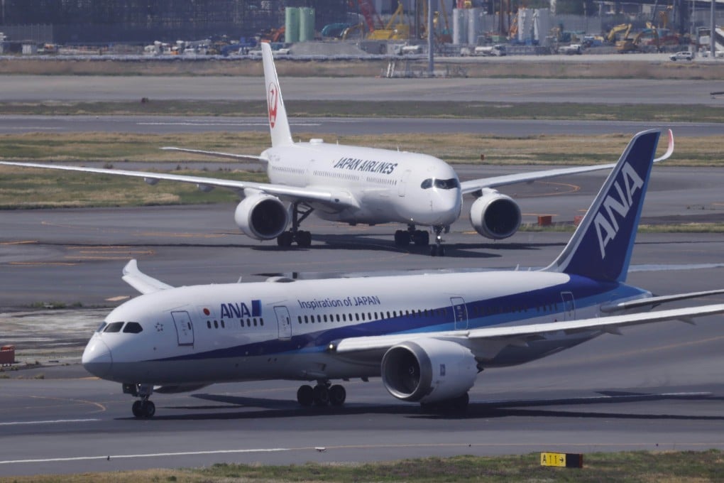 ANA and Japan Airlines planes taxi at Haneda airport in Tokyo on April 12, 2026. Photo: Kyodo