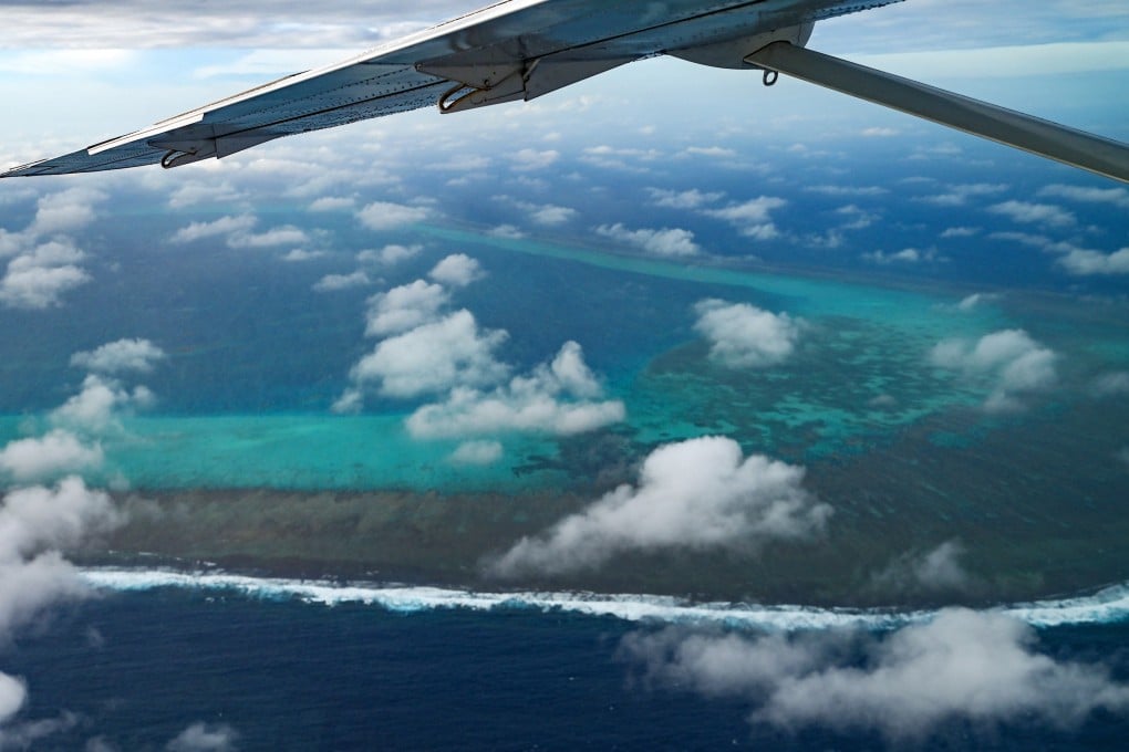 Scarborough Shoal in the South China Sea comes into view during an aerial reconnaissance flight on February 18, 2025. Photo: AFP