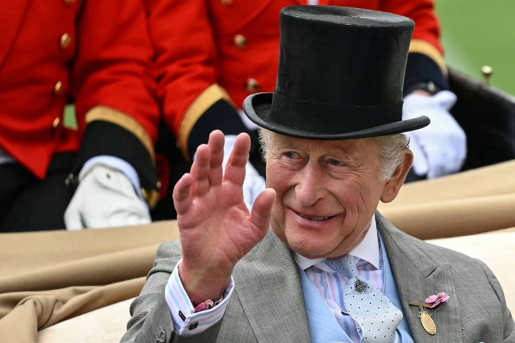 Britain’s King Charles waves as he arrives on the second day of the Royal Ascot horse racing meeting on June 17. Photo: AFP