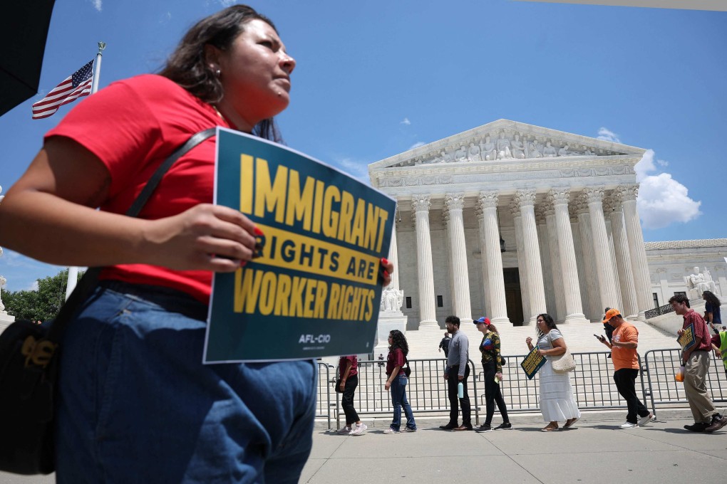 Immigration activists rally against the US Supreme Court’s ruling on temporary protective status in Washington on Thursday. Photo:  AFP