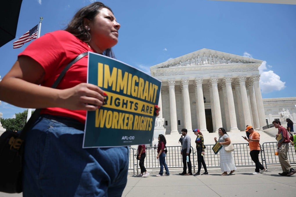 Immigration activists rally against the US Supreme Court’s ruling on temporary protective status in Washington on Thursday. Photo: AFP