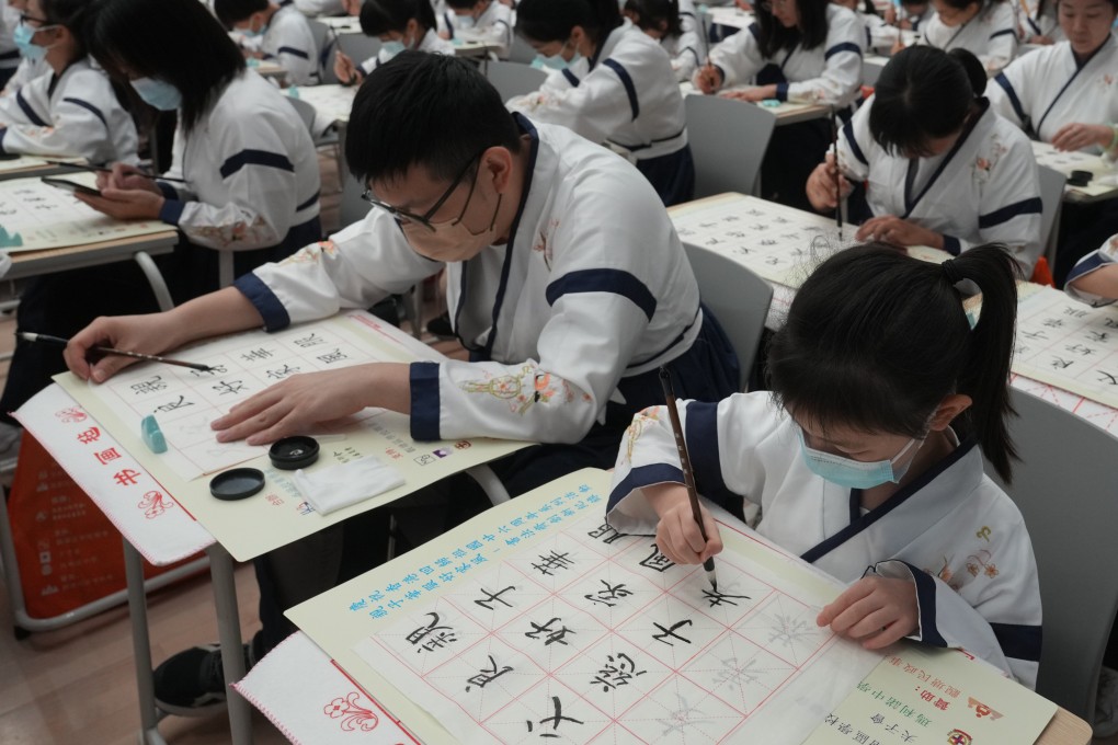 The Hong Kong Academy of School Managers holds an event on traditional Chinese costume and calligraphy at Maryknoll Secondary School in Sau Mau Ping on July 9, 2023. Some of the most significant changes in the Chinese language shaped by foreign influences have occurred not in vocabulary but in the grammar and sentence structures that shape how Chinese is written and spoken. Photo: Sam Tsang