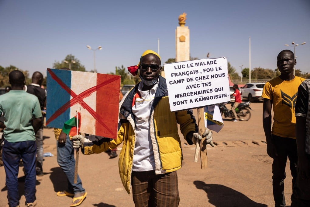 A man holds a placard during a protest to support the Burkina Faso President Captain Ibrahim Traore and to demand the departure of France’s ambassador and military forces, in Ouagadougou in January 2023. Photo: AFP
