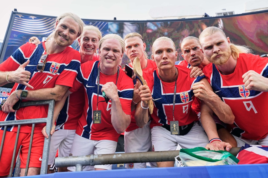 Norway fans dressed up as star striker Erling Haaland pose for a photographer after their side’s World Cup Group I clash with France. Photo: AP