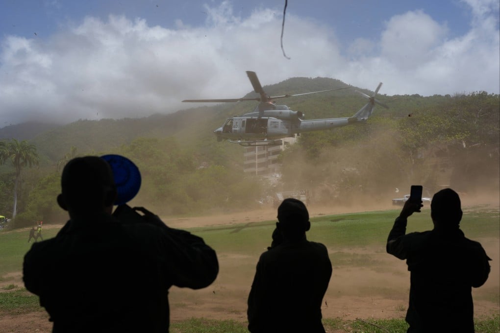 A US military helicopter takes off after delivering humanitarian aid in La Guaira, Venezuela, on Saturday. Photo: AP