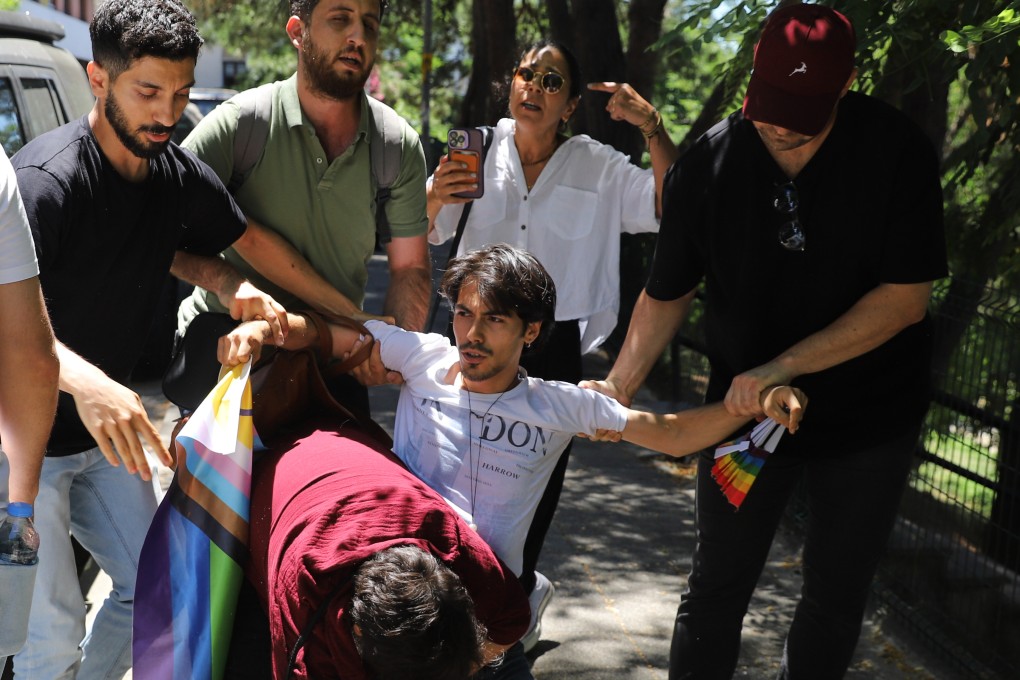 People are detained by police during a Pride march in Istanbul, Turkey on Sunday. Photo: AP