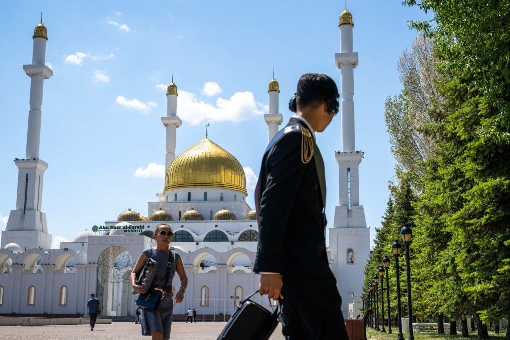 People walk past the Nur-Astana Mosque, the third largest mosque in Central Asia, in Astana, Kazakhstan, on May 25. Photo: AFP