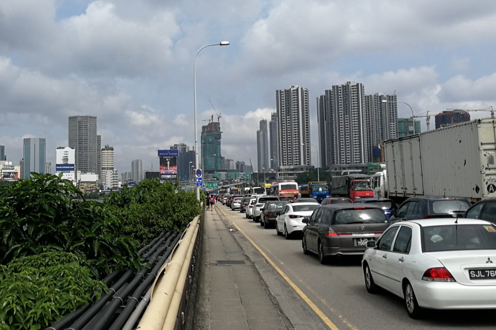 Vehicles queue on the Johor-Singapore Causeway to enter Malaysia’s Johor state. Photo: Shutterstock