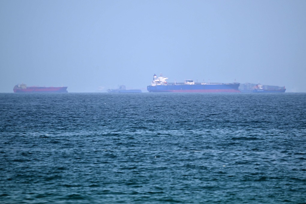 Cargo ships wait off the coast of the Khor Fakkan Container Terminal along the Gulf of Oman. Commercial shipping through the nearby Strait of Hormuz has faced severe disruptions. Photo: AFP