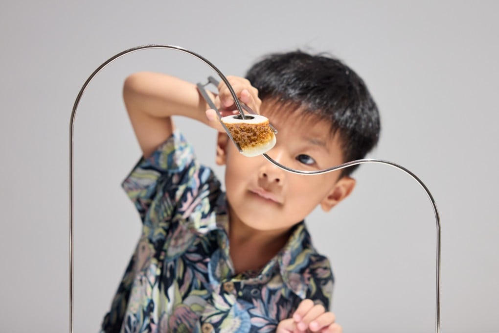 A visitor tries his hand at a challenge at “Design Ah! Experience the Wonder of Everyday Design”, a new exhibition based on a popular Japanese TV series at Hong Kong’s M+ museum. Photo: M+