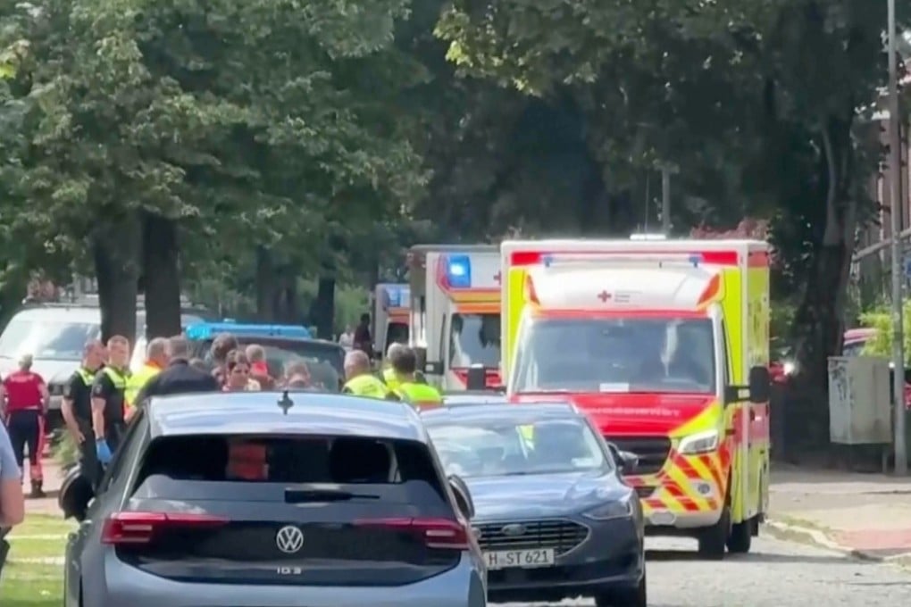 Emergency responders and residents in Stade, Germany, on Monday after five people died in a shooting. Photo: via AP