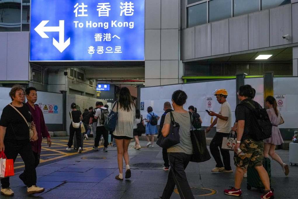 Travellers arrive at a border crossing connecting Hong Kong and Shenzhen in April. Photo: Sun Yeung