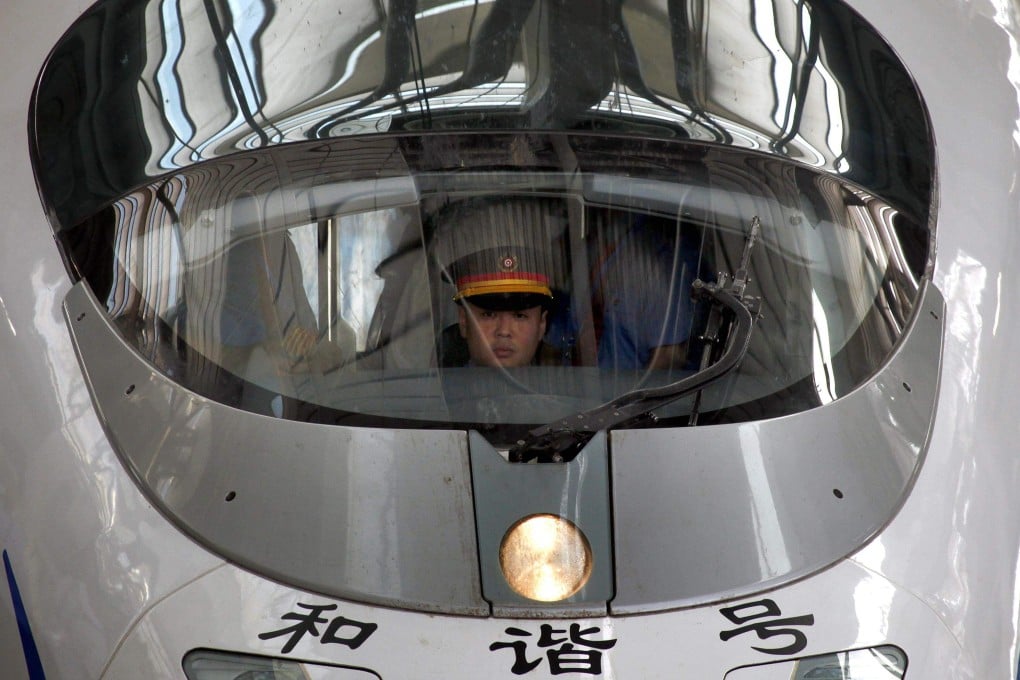 A train driver sits in a new high-speed train before it departs from the Beijing-South railway station for Shanghai as part of an official trip for members of the media June 27, 2011. Photo: Reuters