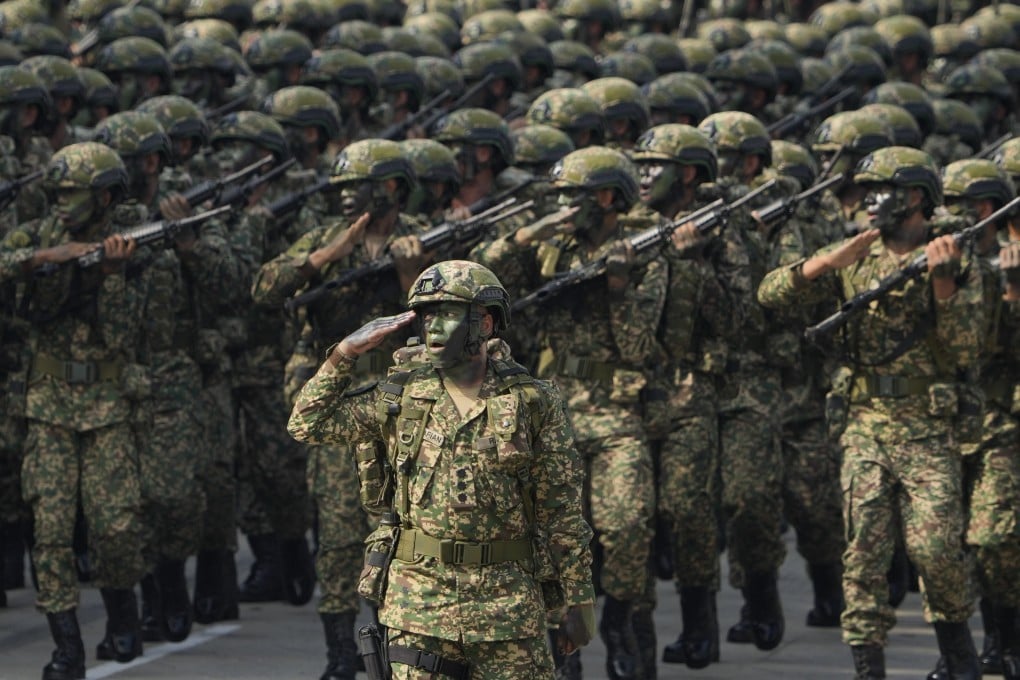 Malaysian soldiers march in formation during National Day celebrations in Kuala Lumpur in 2022. Photo: AP