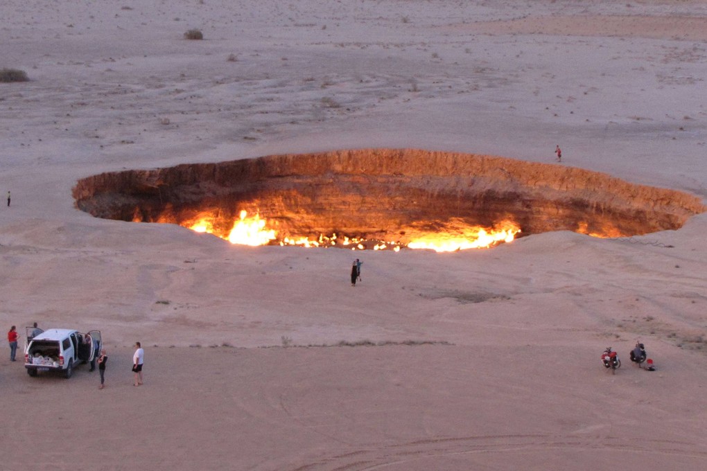 People visiting the “Gateway to Hell”, a crater of burning gas in the heart of Turkmenistan’s Karakum Desert. Photo: AFP
