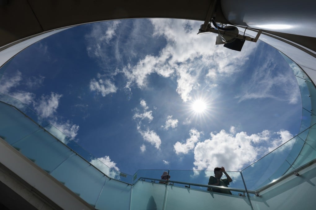 Visitors under the scorching sun at the Tsim Sha Tsui waterfront on Tuesday. Photo: Jelly Tse