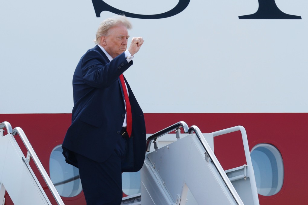 President Donald Trump waves as he boards the new Air Force One, a gift from Qatar. Photo: AP