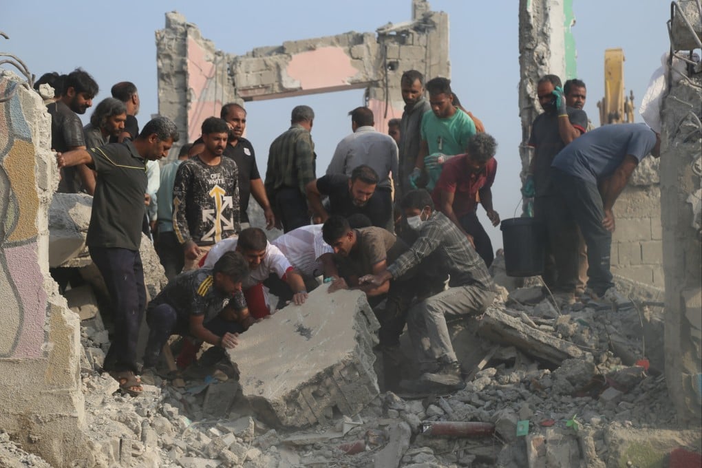 Iranians search through the rubble in the aftermath of the February 28 strike on the school in Minab. Photo: Mehr News Agency via AP