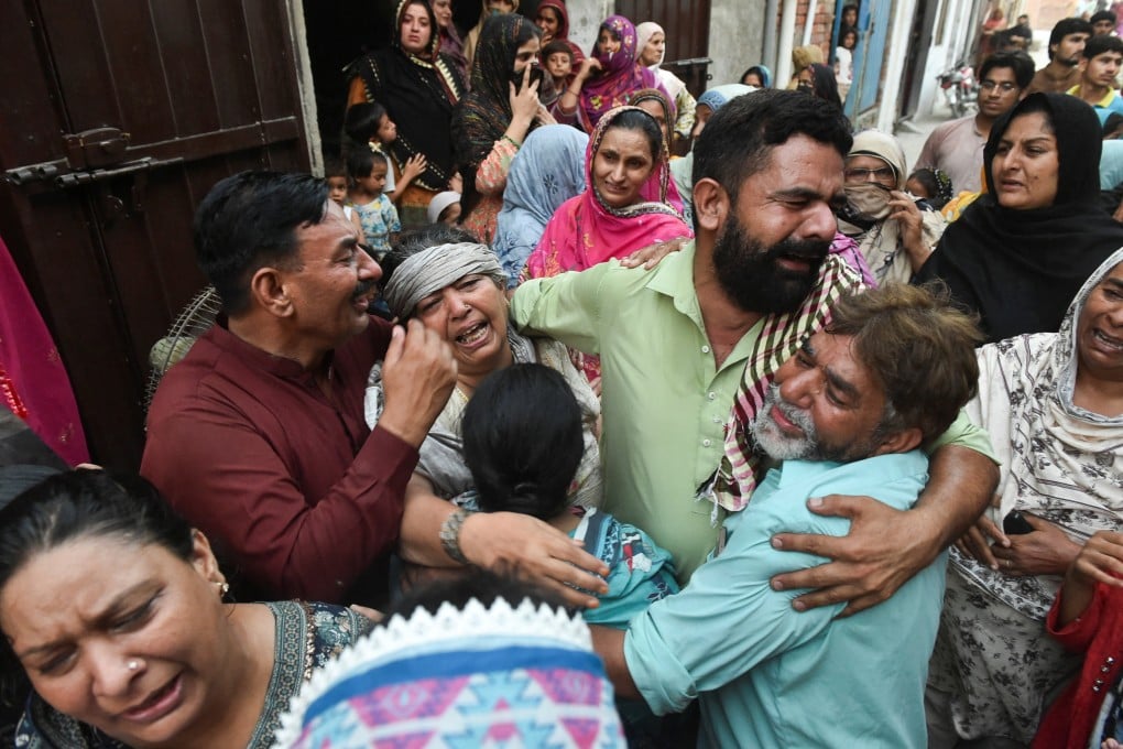 Relatives mourn after a roof collapse at a tutoring centre killed 14 children in Lahore, Pakistan on Tuesday. Photo: Reuters