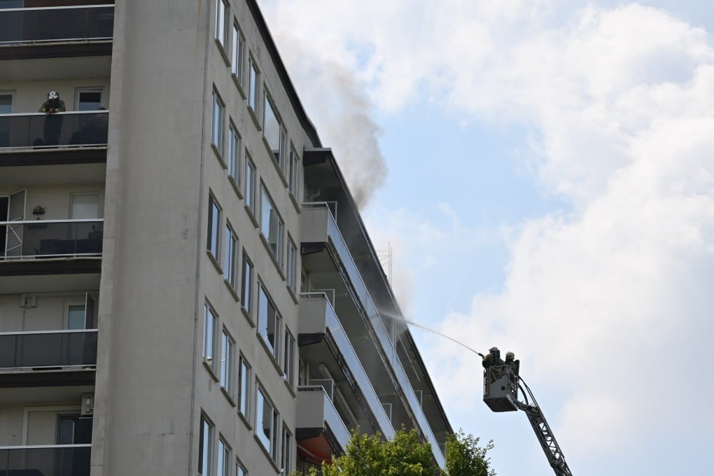 Firefighters try to extinguish a fatal fire in an apartment building in Antwerp, Belgium, on Wednesday. Photo: via Xinhua