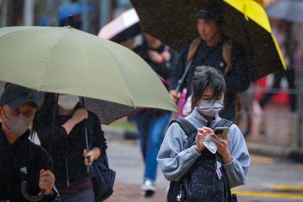 People young and old walk in the rain in Tai Wai. Photo: Sam Tsang