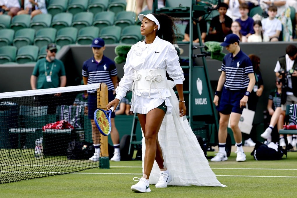 Japan’s Naomi Osaka arrives on court for her second-round Wimbledon match against Anastasia Gasanova of Russia on Wednesday. Photo: EPA