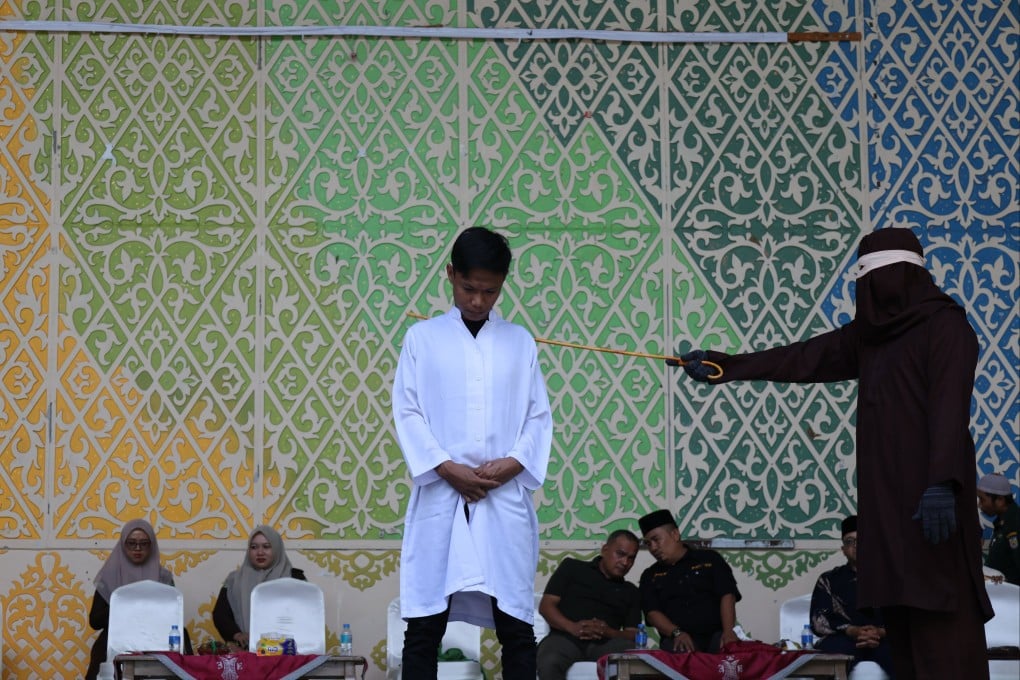 A man reacts to lashing in Banda Aceh, Indonesia, on Thursday. Photo: EPA