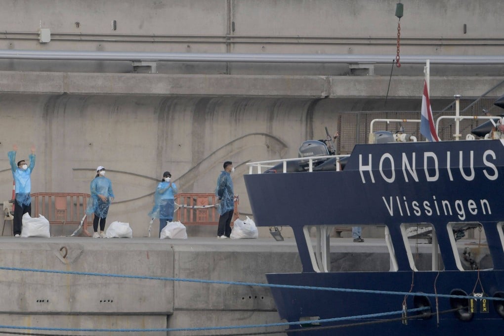 People in protective gear wait in line after disembarking from the hantavirus-stricken cruise ship MV Hondius docked at Tenerife in Spain’s Canary Islands in May. Photo: AFP