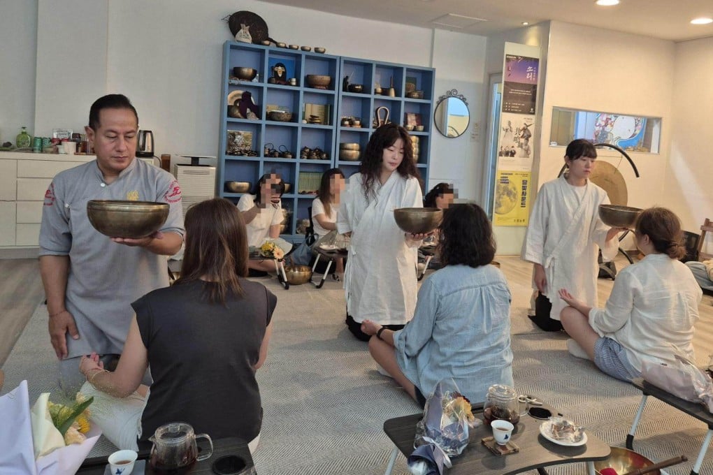 Tourists try singing-bowl meditation at the Saraswati Meditation Centre in Seoul's Gangnam district. Photo: The Korea Times