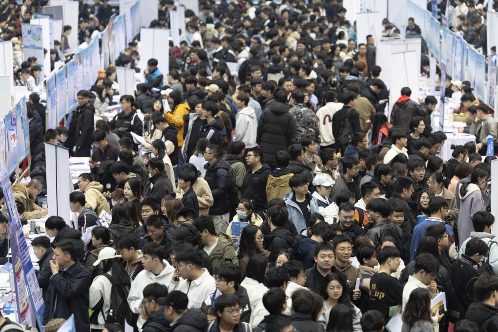 University students look for employment opportunities at a recruitment fair for science and engineering universities in Harbin, Heilongjiang province, in March. Photo: Getty Images