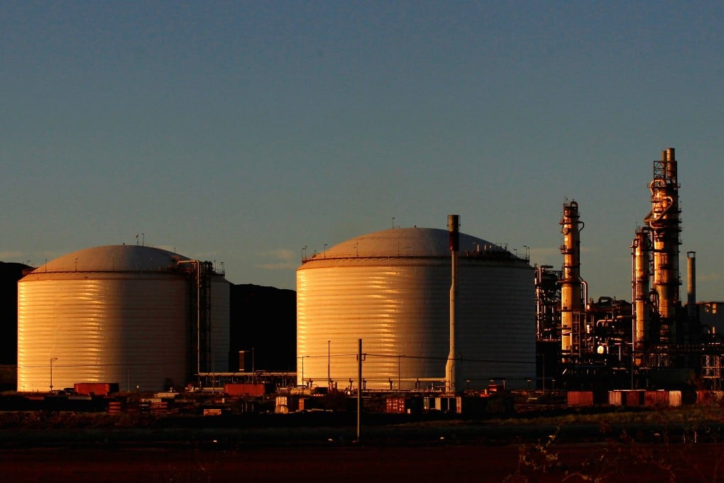 The Woodside Petroleum gas plant is seen at sunset in Burrup, Western Australia. Photo: Reuters