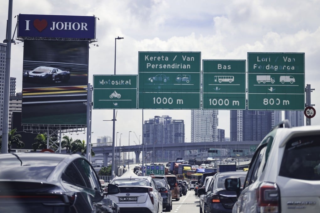 Vehicles are in Malaysia’s southern Johor state just after passing the causeway from Singapore. Photo: Shutterstock