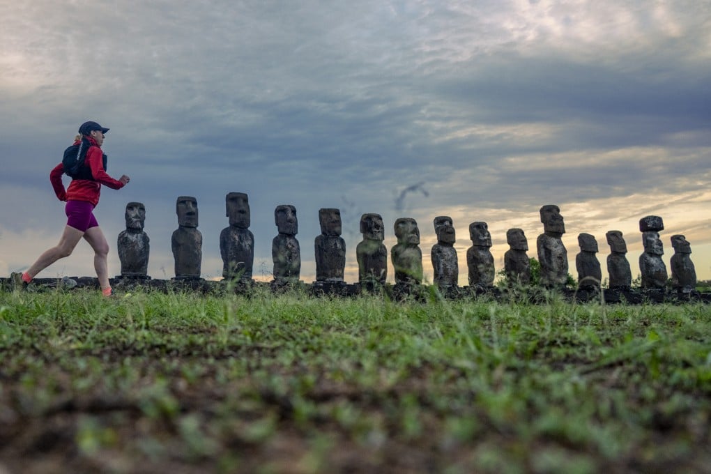 Writer Lily Canter runs past 15 moai statues at Ahu Tongariki, the most famous point on Easter Island, or  Rapa Nui, during her five-day tour organised by Rat Race. Photo: Leo Francis/Rat Race