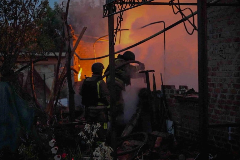 Firefighters work at an apartment building hit by a Russian drone strike in Sumy, Ukraine, on Friday. Photo: Press service of the State Emergency Service of Ukraine in Sumy region via Reuters