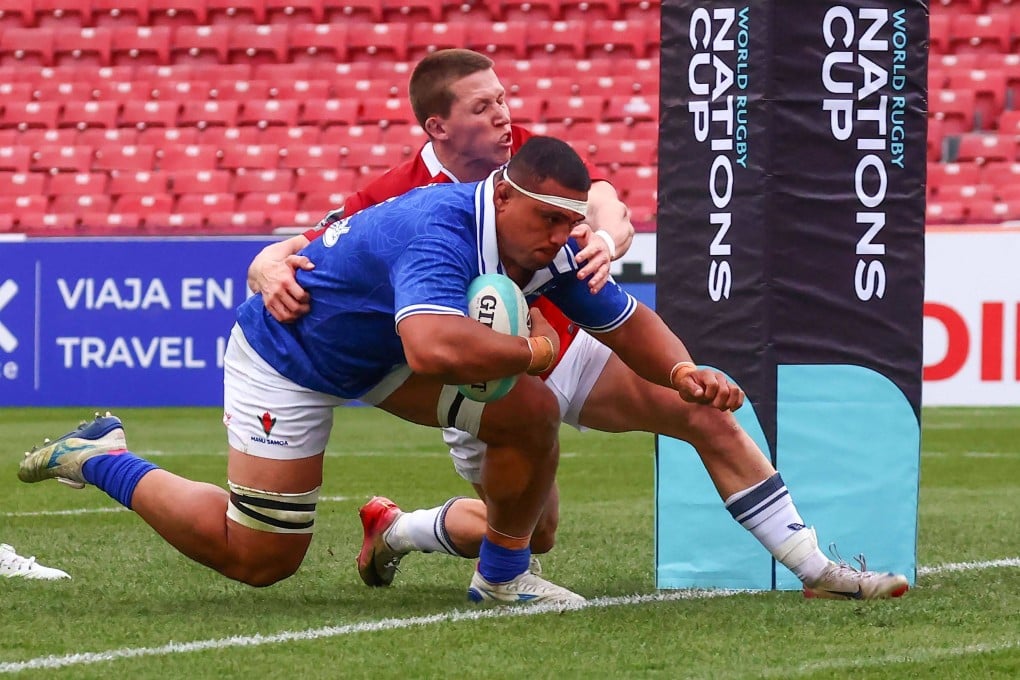 Lakopo Mapu of Samoa scores his side’s seventh try despite the challenge of Marcus Ramage of Hong Kong. Photo: World Rugby