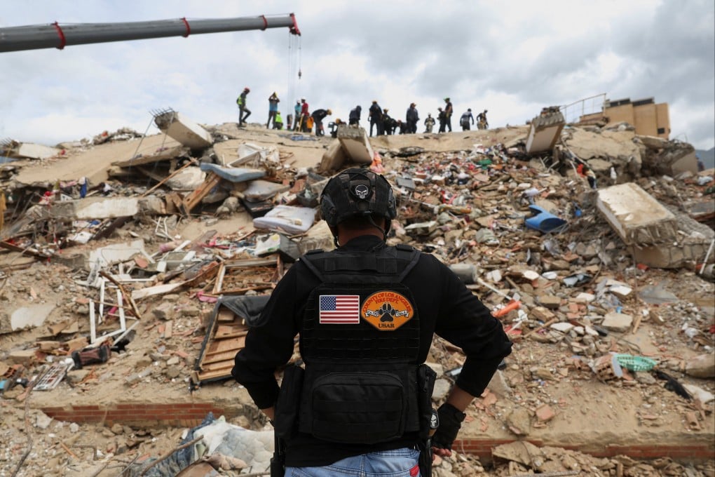 US rescuers work at the site of a collapsed building in La Guaira, Venezuela, on Friday. Photo: Reuters