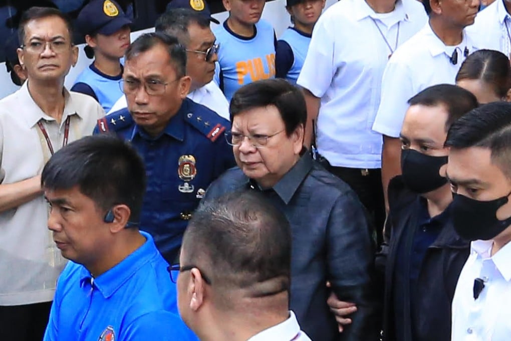 Philippine Senator Rodante Marcoleta (centre) is escorted by police at the Sandiganbayan special anti-corruption court on Monday. Photo: AP