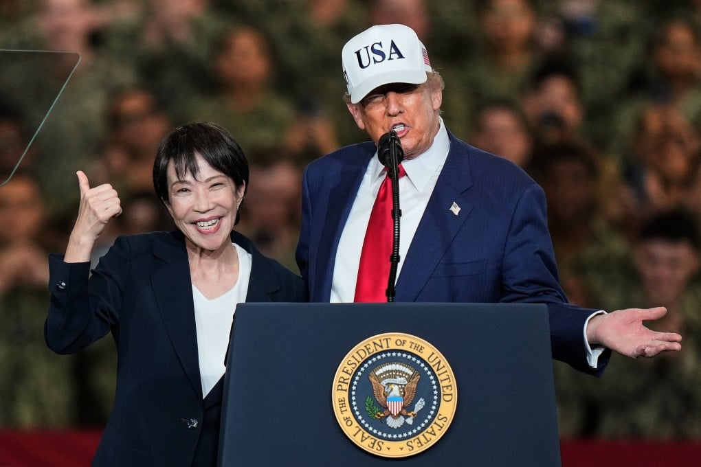 Japanese Prime Minister Sanae Takaichi (left) gestures as US President Donald Trump delivers his speech during their visit to the aircraft carrier USS George Washington at the US Navy’s Yokosuka base south of Tokyo on October 28, 2025. Photo: AP