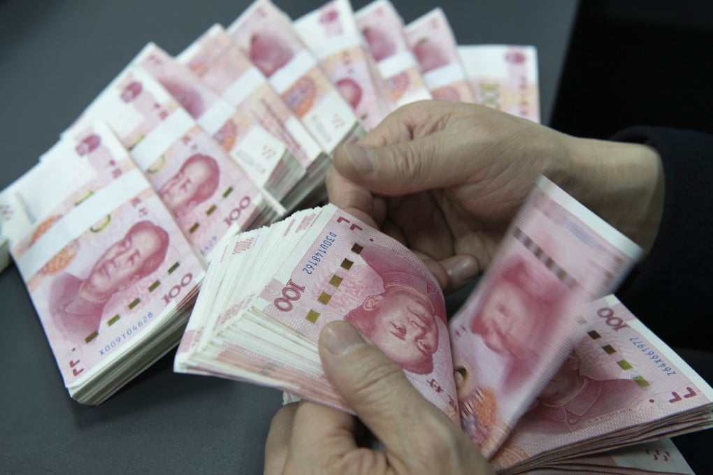 An employee at Construction Bank counts Chinese yuan notes in Hai’an City, Jiangsu province, January 20, 2026. Photo: CFOTO/Future Publishing via Getty Images